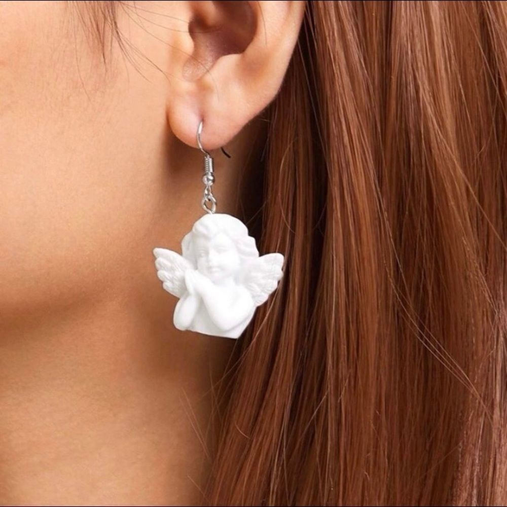 Pair of white angel, cherub, dangle, drop earrings
